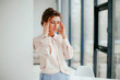 © Катя Іваськевич - young business woman feels tired and has a headache in the office