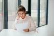 © Катя Іваськевич - portrait of young businesswoman working  in the office and looks at the documents.