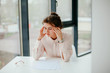 © Катя Іваськевич - young business woman feels tired and has a headache in the office