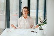 © Катя Іваськевич - young businesswoman meditates in the workplace