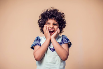 Wall Mural - A portrait of surprised kid boy. Children and emotions concept