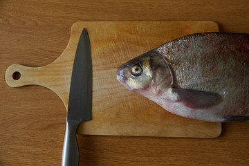 fresh bream on the cutting Board