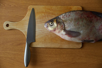 fresh bream on the cutting Board