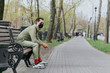 © Кристина Павлова - A man in a protective mask sits on a bench