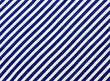 blue and white diagonal stripes. vest, marine backdrop.