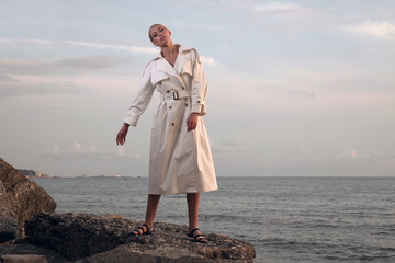 young woman walking on the beach