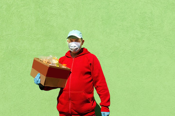 Wall Mural - man with a box of food, help and donation of food