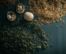 Granulated Brown Coffee, Green Leaf Tea And Whole Walnut In Horizontal Photo, Top View