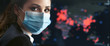 © ANR Production - Young female office worker is shocked by the spread of the coronavirus epidemic. Map of the Covid 19 pandemic worldwide. Girl in a disposable medical facial mask