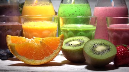 Wall Mural - Assortment of fruit smoothies in glass bottles. Fresh organic Smoothie ingredients. Smoothies for health or detox diet food