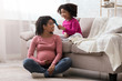 © Prostock-studio - Adorable Toddler Black Girl Combing Hair Of Her Happy Pregnant Mom