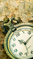 Vintage pocket watch showing time with textured background. concept of time