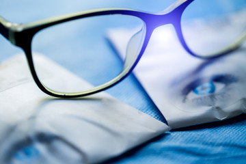 Wall Mural - Modern fashionable spectacles isolated on brochure background. Perfect reflection. Glasses closeup