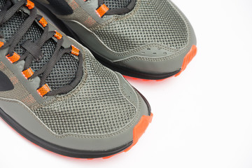 Grey and orange sport running shoes isolated on white background. Sneaker running sports shoes.