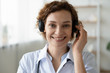 © fizkes - Smiling female doctor wearing headset looking at camera. Remote online medical chat consultation, telemedicine distance services, virtual physician conference call concept. Head shot close up portrait