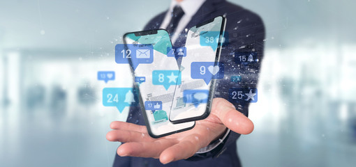 Wall Mural - businessman holding social network notifications - 3d rendering