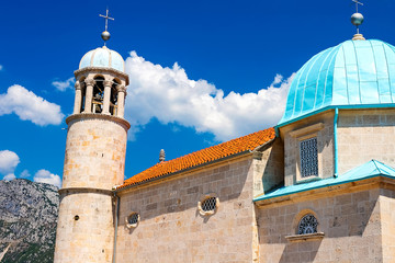 Wall Mural - Amazing view of the church with a blue bath on the island of the Virgin on a reef in the Bay of Kotor, Montenegro