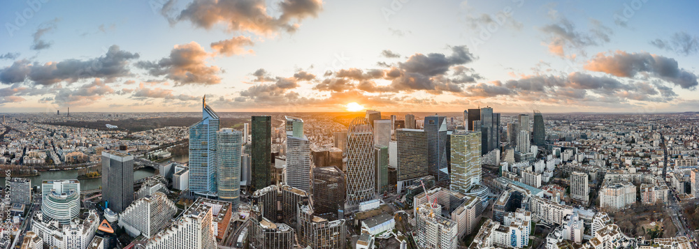 Aerial panoramic drone shot of La Defense skycraper in Paris CBD skyscraper complex business district with clouds during sunset - obrazy, fototapety, plakaty 