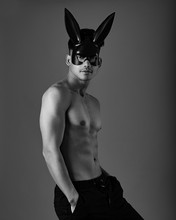 A Guy With A Naked Torso In A Bunny Mask