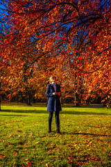 Wall Mural - middle-aged woman walking in city park