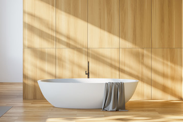 Minimalistic wooden bathroom interior with tub