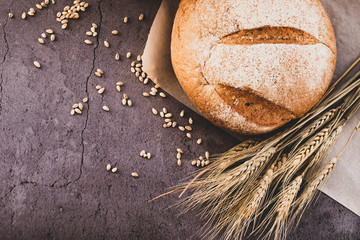 spikelets of wheat and fresh bread on the table