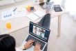 © weedezign - asian woman work from home with video conference app collaboration with colleagues with business chart on tablet.live streaming meeting.protect risk of being exposed to coronavirus (covid-19)