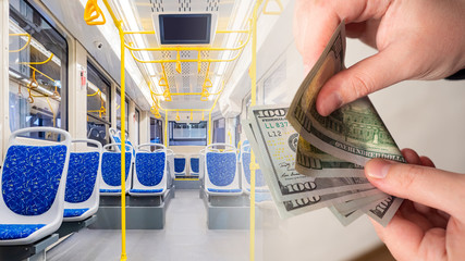 Hands with money on the background of the bus interior. Payment for public transport. Cash and non-cash payment for travel. Transport cost. A fine for a stowaway.