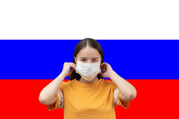 Poster - The danger of coronavirus in Russia. Young girl in antibacterial medical mask on a flag background