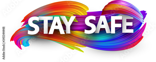 Fotomural Big stay safe sign over brush strokes background.