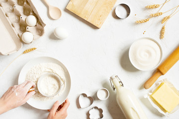 Wall Mural - Background with ingredients for home baking decorated with wheat ears