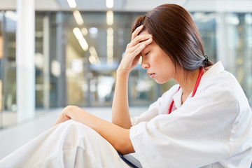 Sticker - Woman as a nurse with hand on forehead