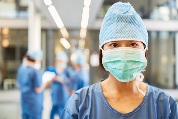 Wall Mural - Young anesthetist with surgical mask and hood