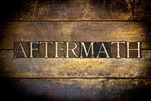 Photo Of Real Authentic Typeset Letters Aftermath Text On Vintage Textured Grunge Copper And Gold Background