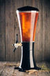 Beer tower with hop, malt and wheat on wood background