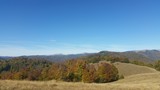 Fototapeta Na ścianę - autumn mountains landscape on sunny day with colorfully forest meadow and trees