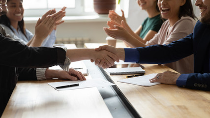 Poster - Close up female leader and businessman shaking hand congratulation on successful contract. Manager making business deal on clap hands colleague at meeitng. Confirm successful handshake gesture.