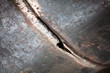 Fragment of the main pipeline. Gas supply to an industrial facility. In the frame, the weld defect is a hole and a crack on the steel pipe.