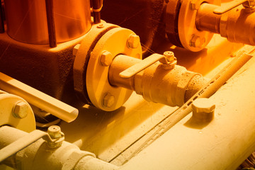 Water supply system of an apartment house. In the frame of a fragment of the pump and valves - the valve is closed. Horizontal frame. Ukraine, Kiev region Color image.