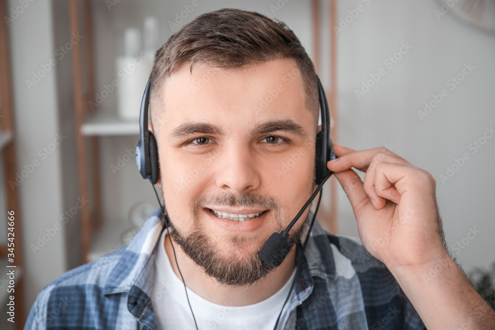 Male technical support agent working at home