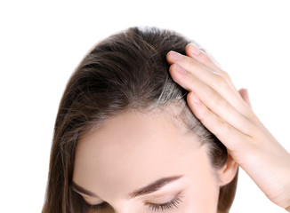 Young woman with grey hair on white background, closeup