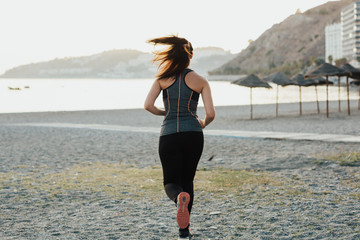 woman doing sports on the beach