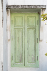 Poster - Old green window on classic house wall background.