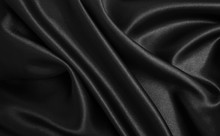 Smooth Elegant Black Silk Or Satin Texture As Abstract Background. Luxurious Background Design