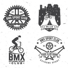 Wall Mural - Set of bmx extreme sport club badge. Vector. Concept for shirt, print, stamp, tee with man ride on a sport bicycle. Vintage typography design with bmx cyclist and night city silhouette.