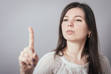 girl pointing at something invisible