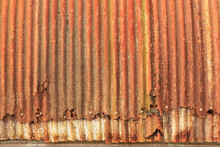 Rusty, Overlapping Sheets Of Corrugated Iron From An Old Quonset Hut