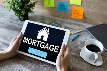 Mortgage online application form on device screen. Business and finance concept.