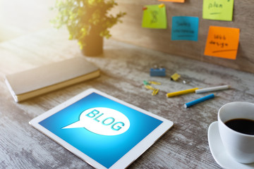 Wall Mural - tablet with blog text the on screen. social network, communication and internet marketing concept.