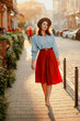 © Катя Іваськевич - young woman walking on the street in a dress